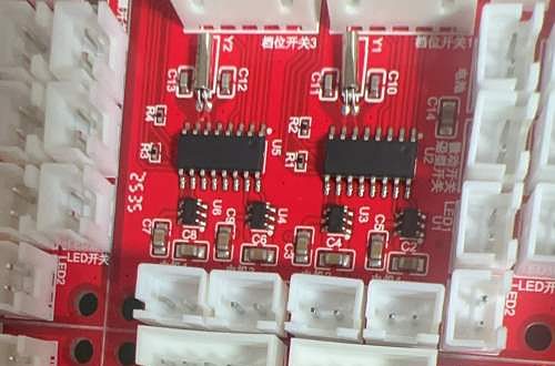 Red assembled circuit boards with SOIC chips and white wire-to-board connectors